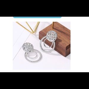 Medallion and hoop earrings